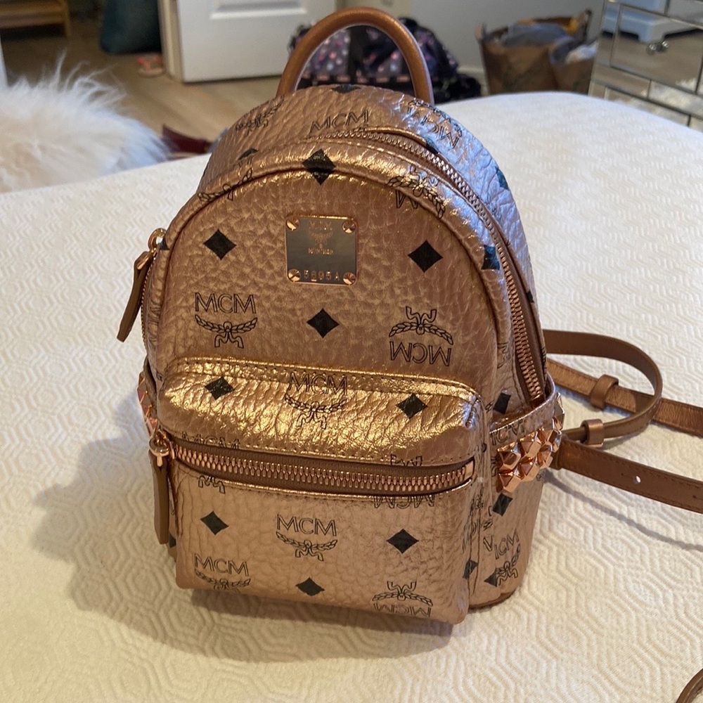 MCM Rose gold metallic mini backpack with studs on the sides